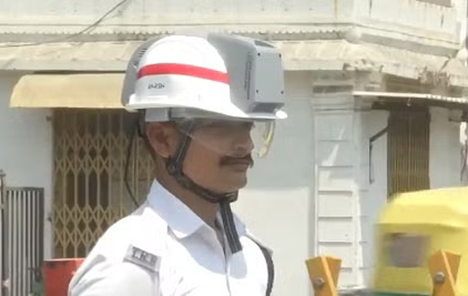 Traffic cop wearing AC helmet 